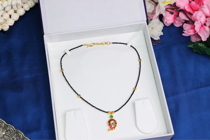 Elegant Mango Jadau Pendant with Black Beads